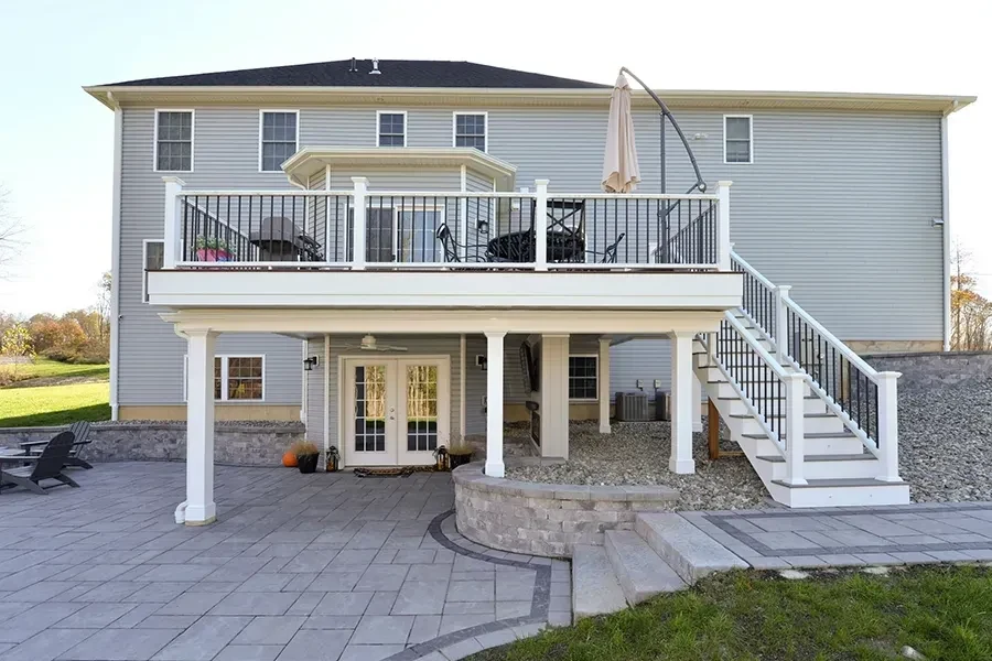 Raised white-railed deck and stairs