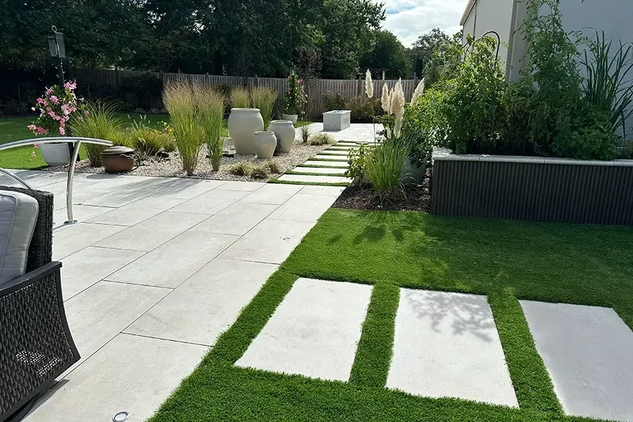 Patio and lawn connected by stepping stones